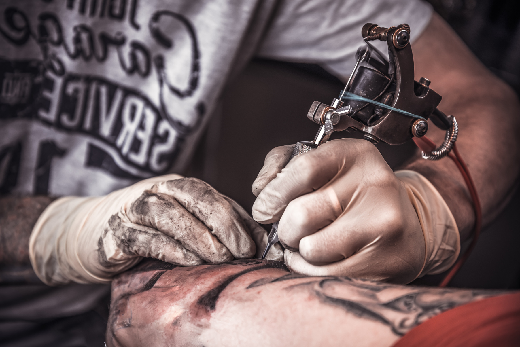 Professional Tattooer Burning the Tatoo
